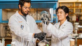 Two students working in a research lab